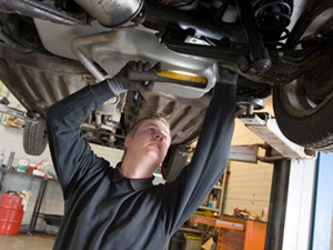 mechanic working under car