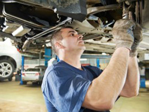 mechanic working under car