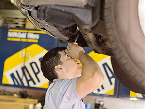 mechanic working under car